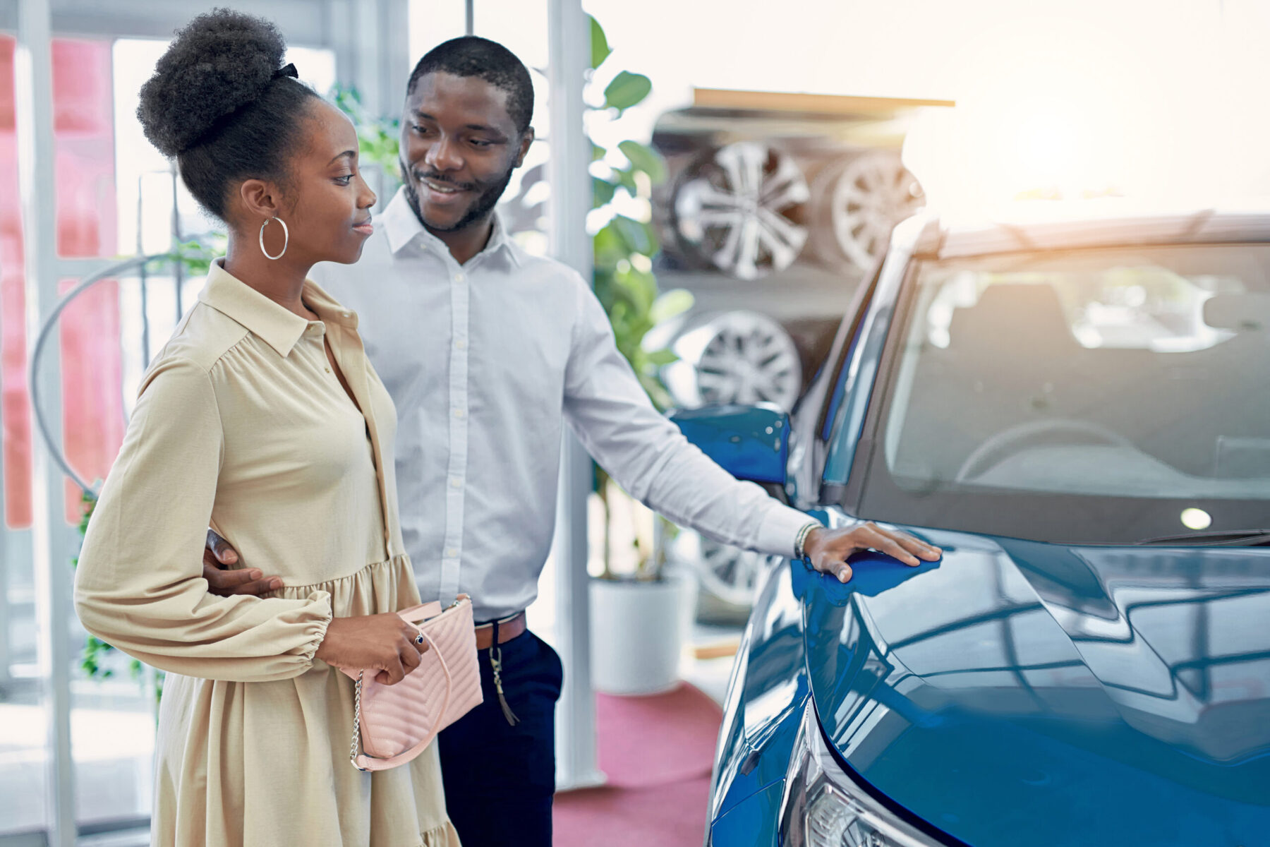 Man and woman buying car.