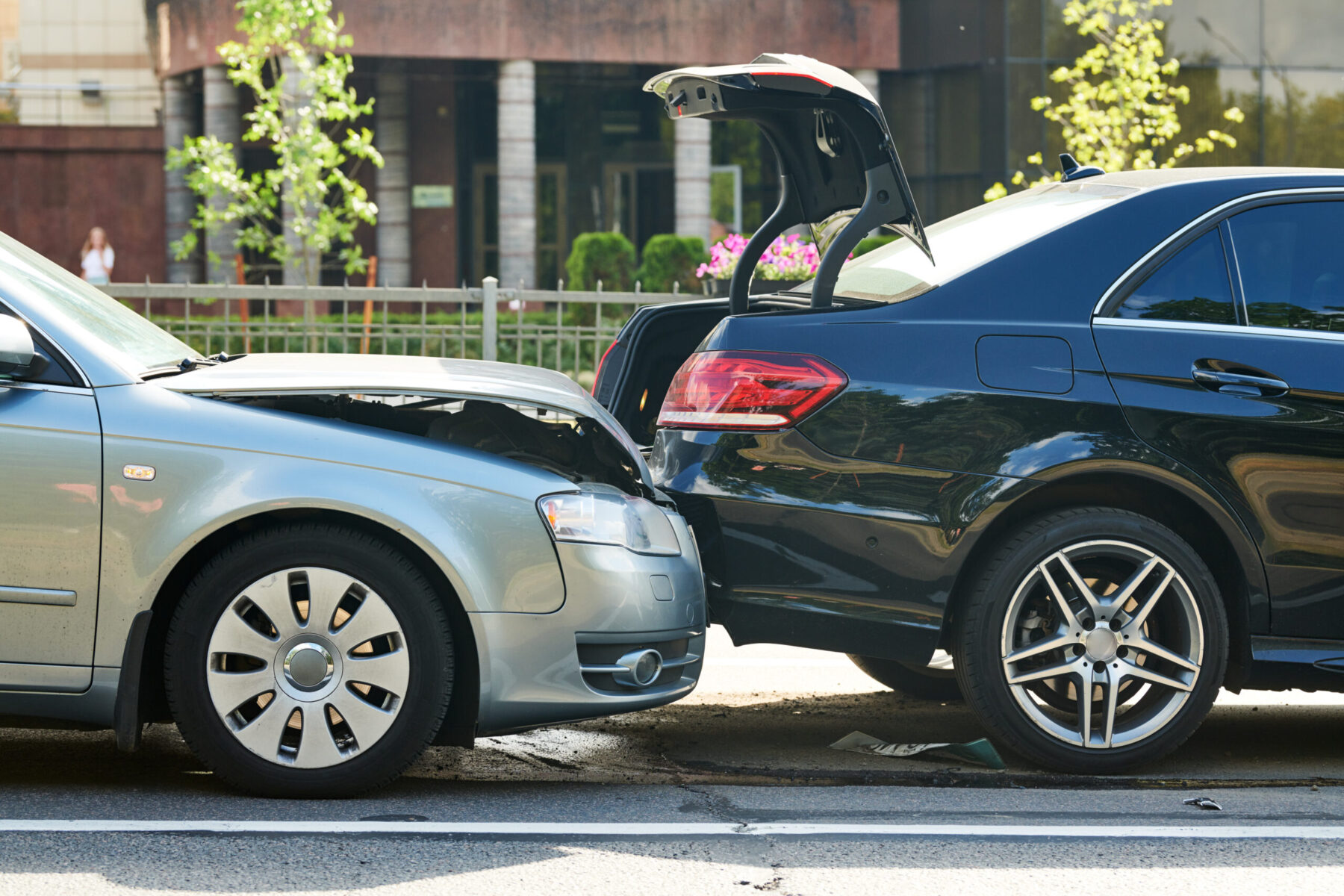 Car collision on city street. car crash accident. Two damaged automobiles