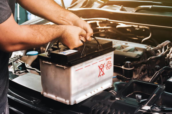 Person taking out car battery.