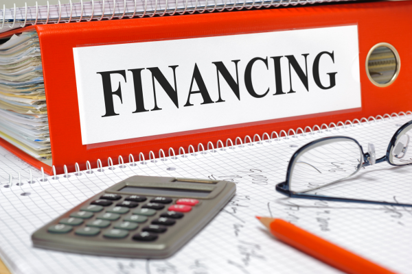 Binder with words financing and calculator.