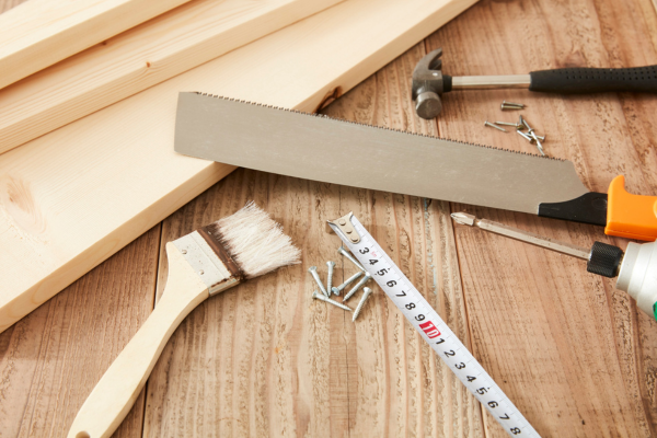 Close up of tools on wooden table.