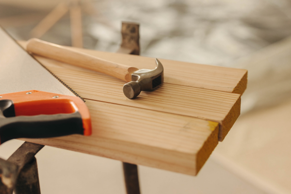 View of hammer on pieces of wood.