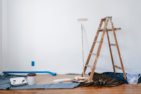 View of latter and tools on floor.